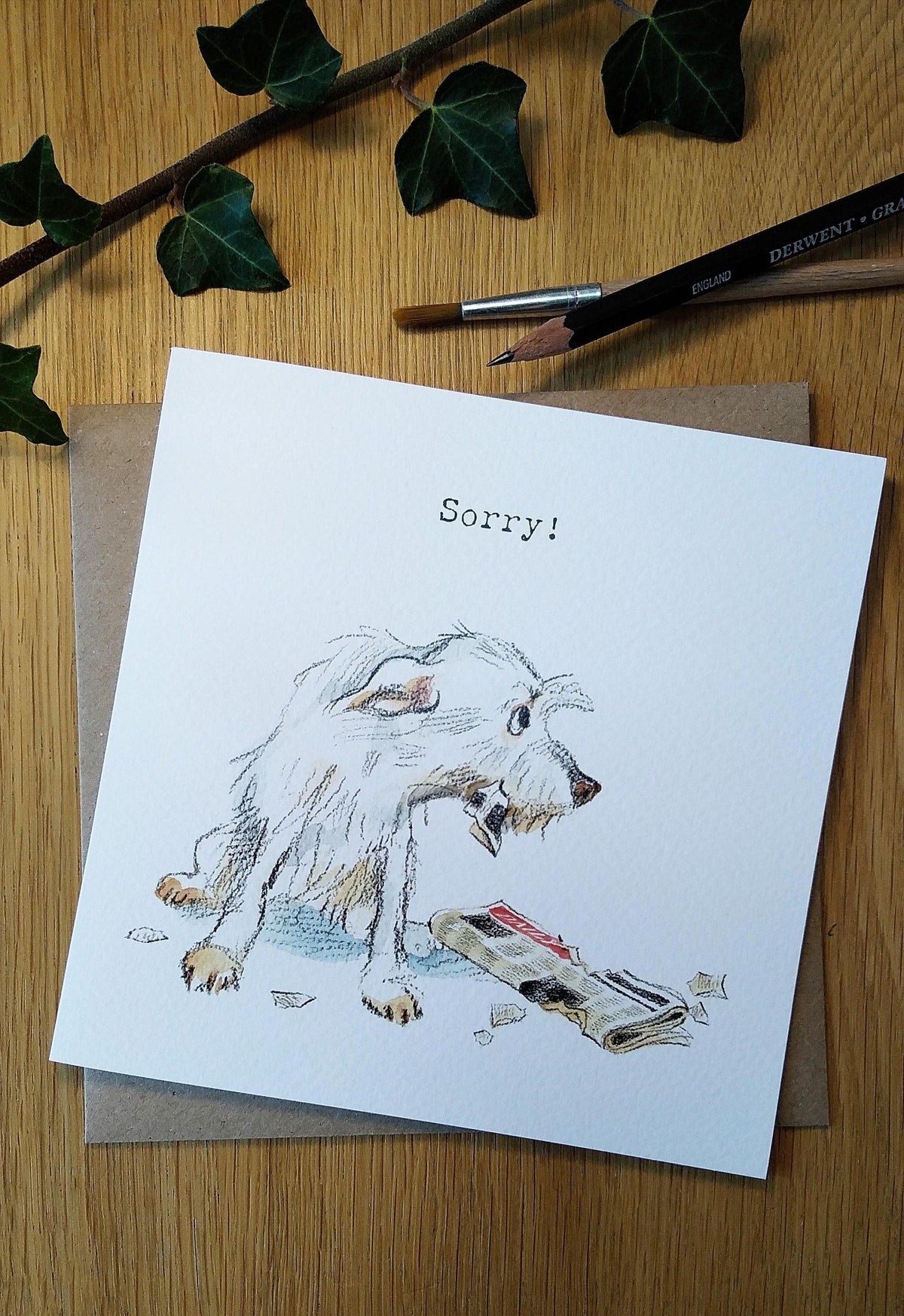 Cute Dog Card - Sorry - White Dog with Newspaper